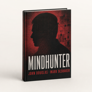 Libro Mindhunter de John Douglas y Mark Olshaker en tapa dura sobre perfilación criminal